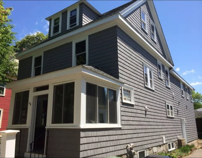 Completed gray shingle siding renovation